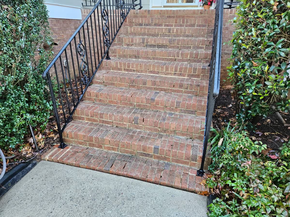 Brick front steps and walkway after pressure washing, algae removed